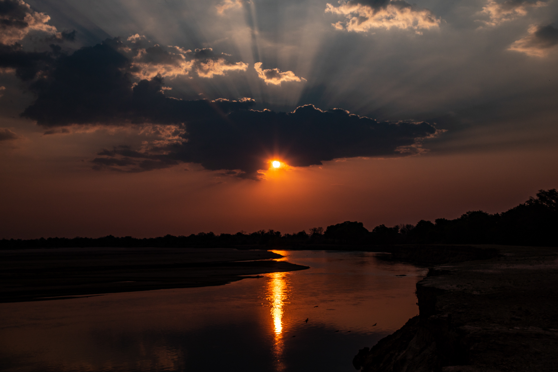 Clouds form over the Luangwa River to create a stunning sunset (image by Inger Vandyke)