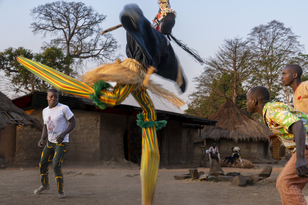 Motion blur of the twirling stilt dancer in Godoufou (image by Rosalie Wang)