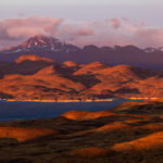The Patagonian landscape glows in the light of the sunrise (image by Bernd Rohrschneider)