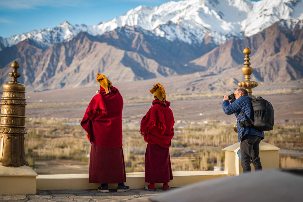 Wild Images guest capturing the early moring Call to Prayer on the Thikse Monastery rooftop (image by Julie-Anne Davies)