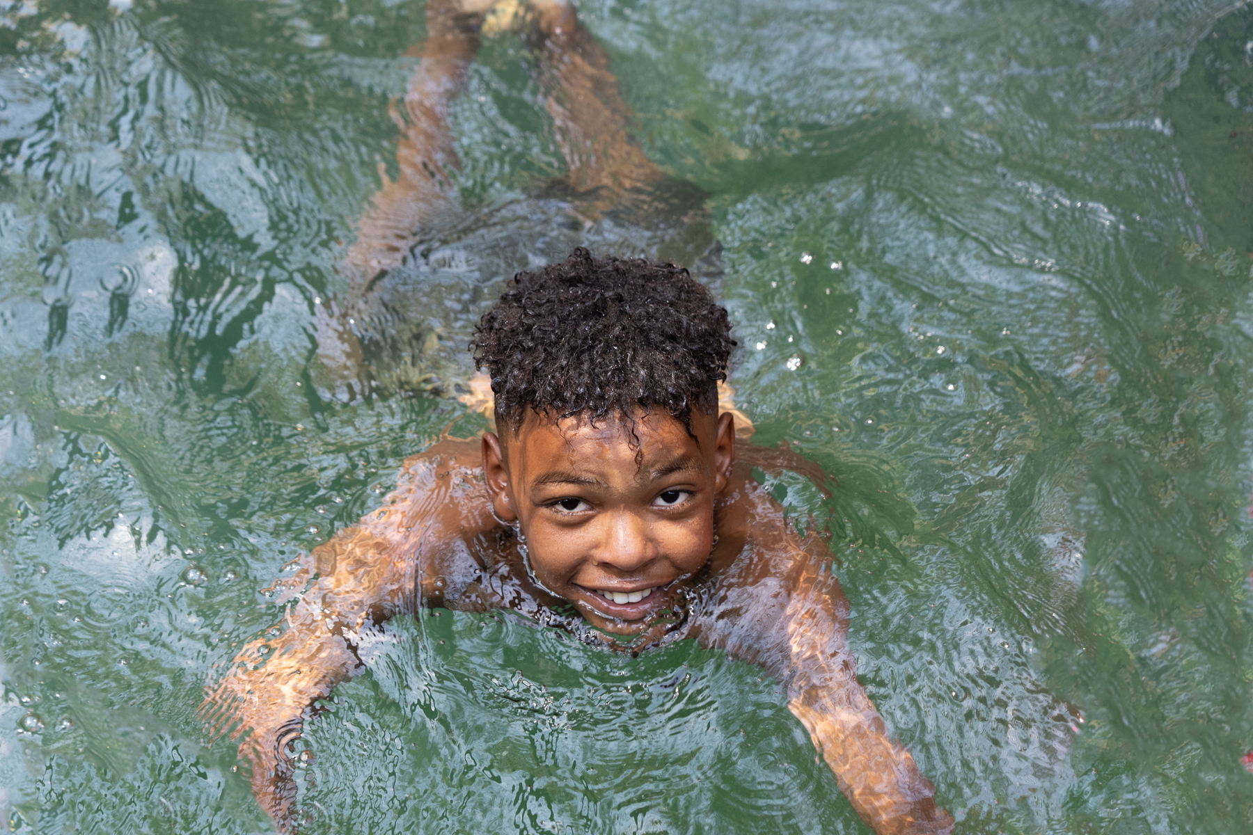 Local boy swimming in the well at the Ksour of Adjahil near Djanet (image by Inger Vandyke)
