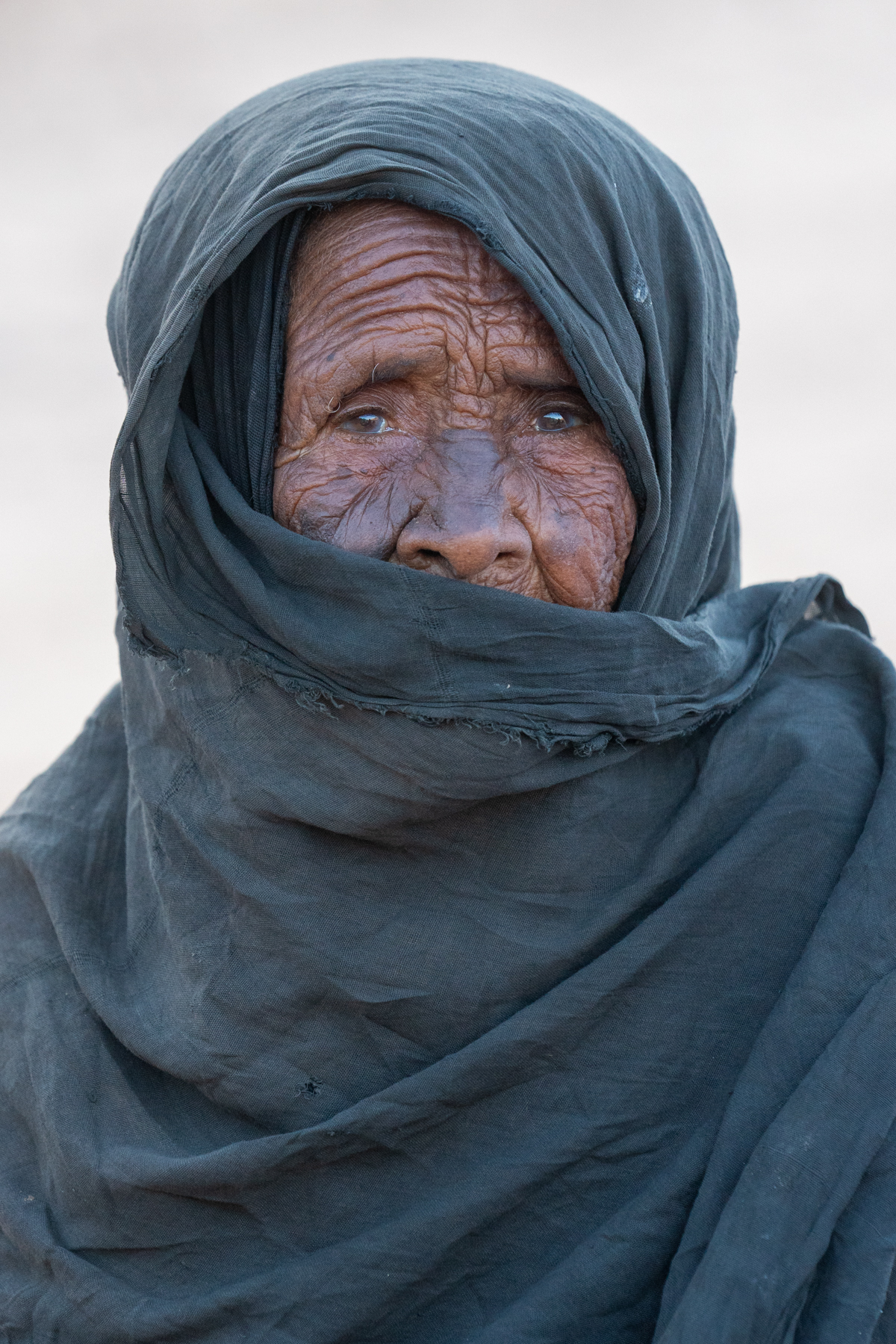 Portrait of an elderly Tuareg woman in the desert (image by Inger Vandyke)