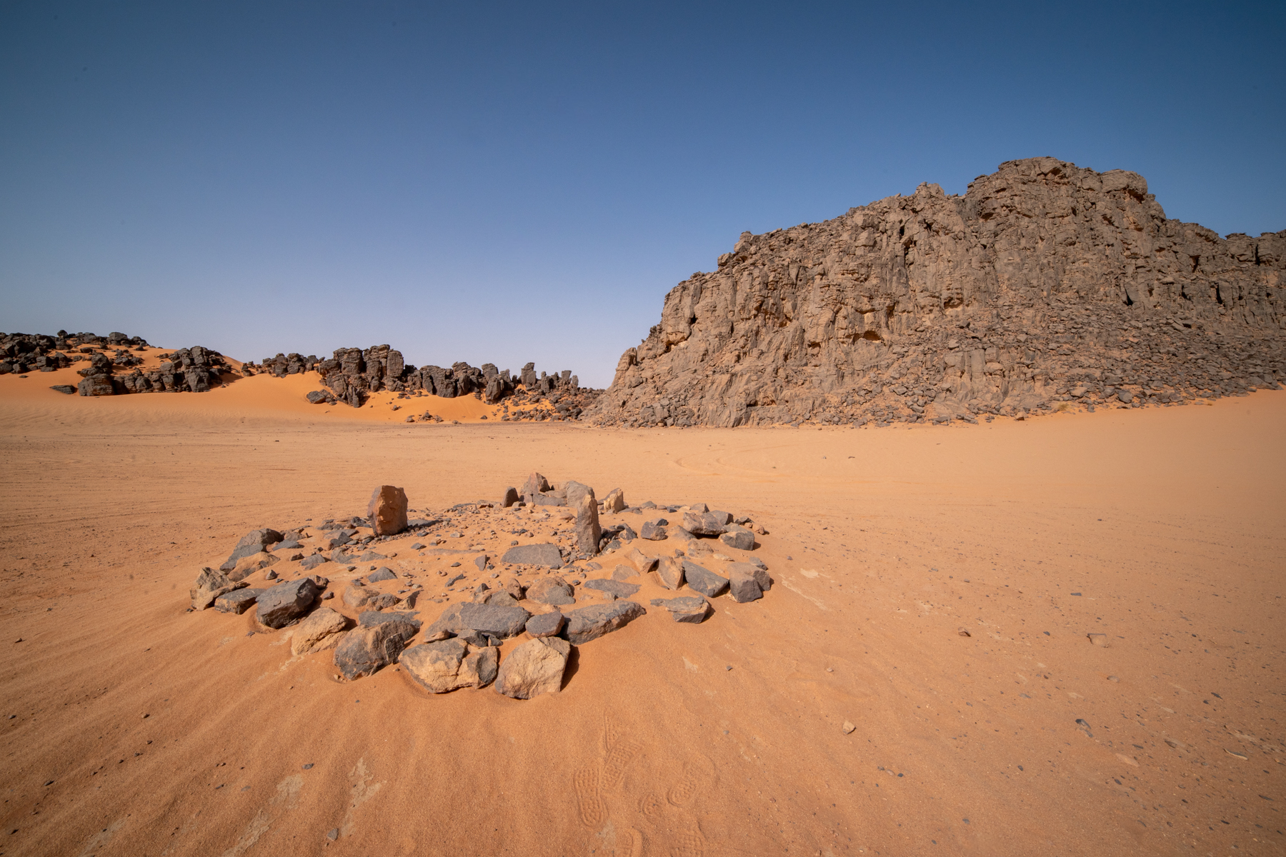 Exploring the grave site of Ghawen, a Chadian trader from Djanet's ancient past (image by Inger Vandyke)