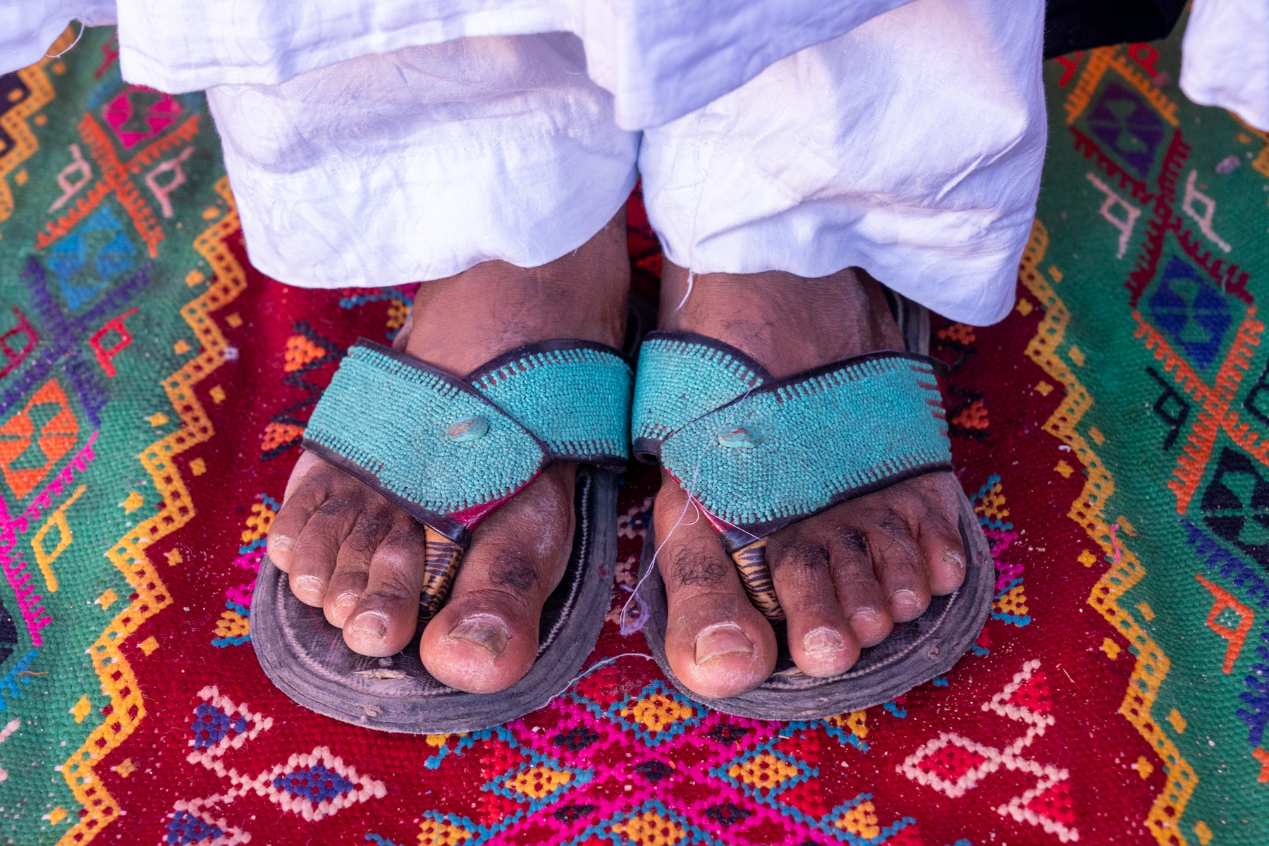 The beautiful turquoise beaded Tanba shoes worn by Tuareg men in celebrations (image by Inger Vandyke)
