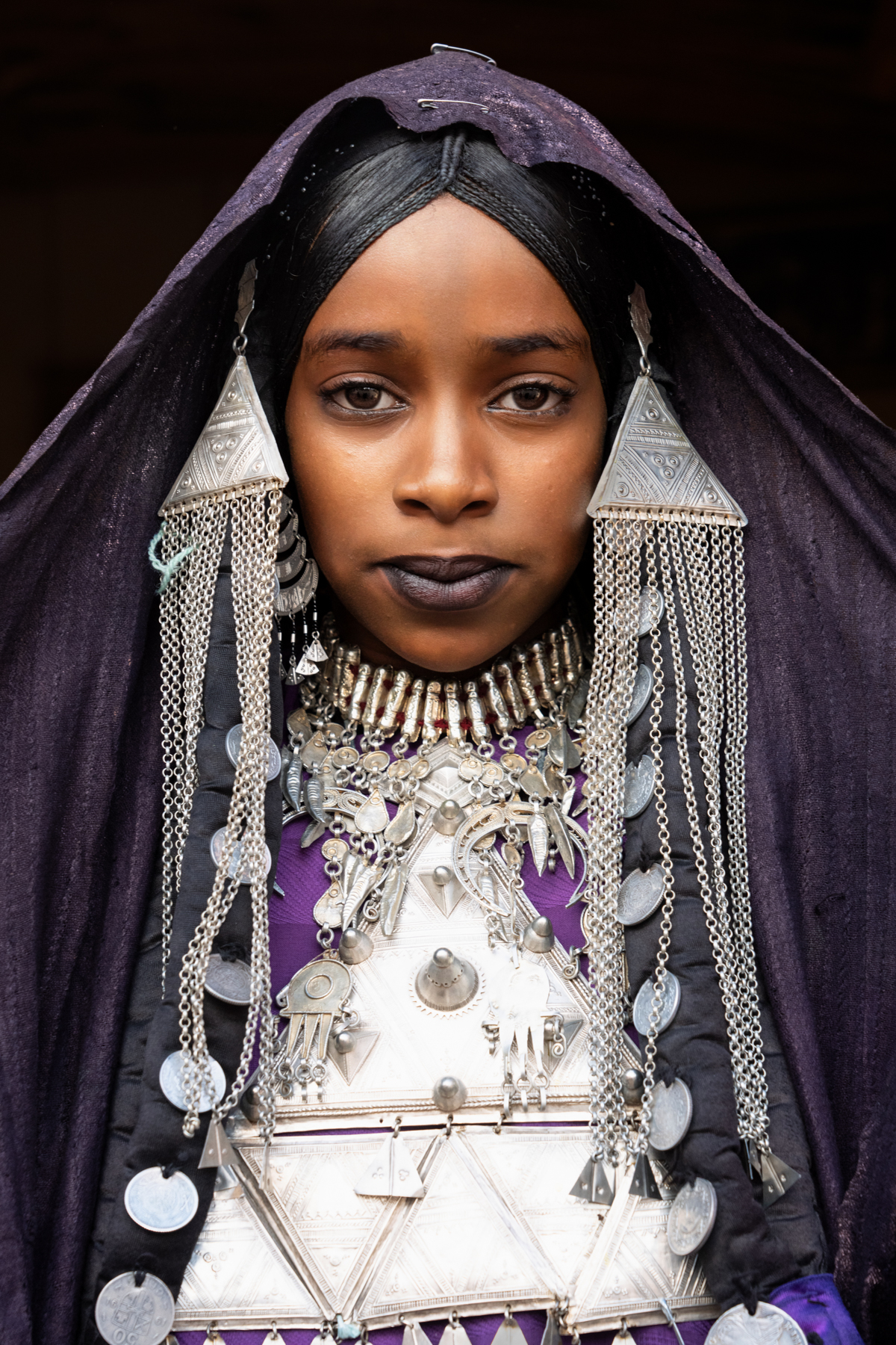 Portrait of a Tuareg girl heavily adorned in traditional silver jewellery (image by Inger Vandyke)