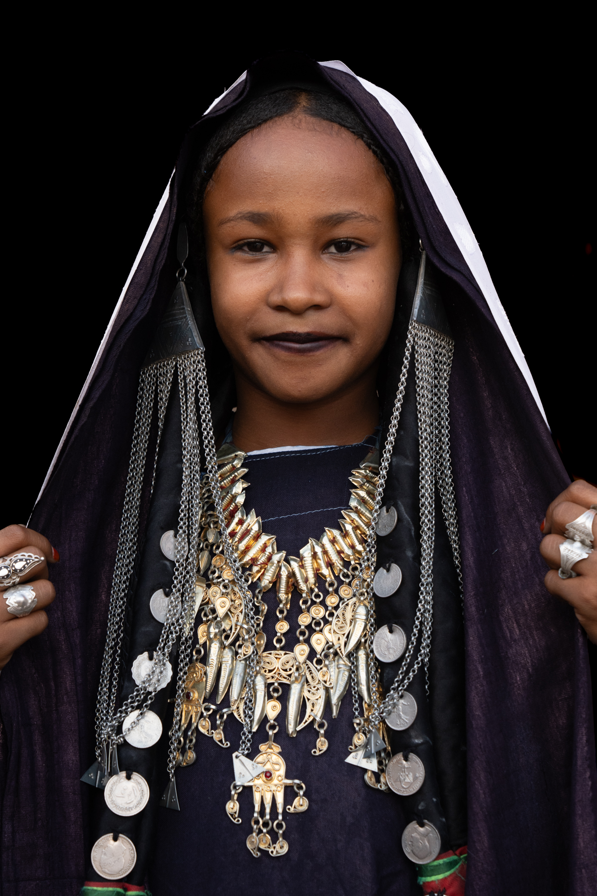 A pretty young girl adorned in silver jewellery for the Tuareg celebration of Sabiba (image by Inger Vandyke)