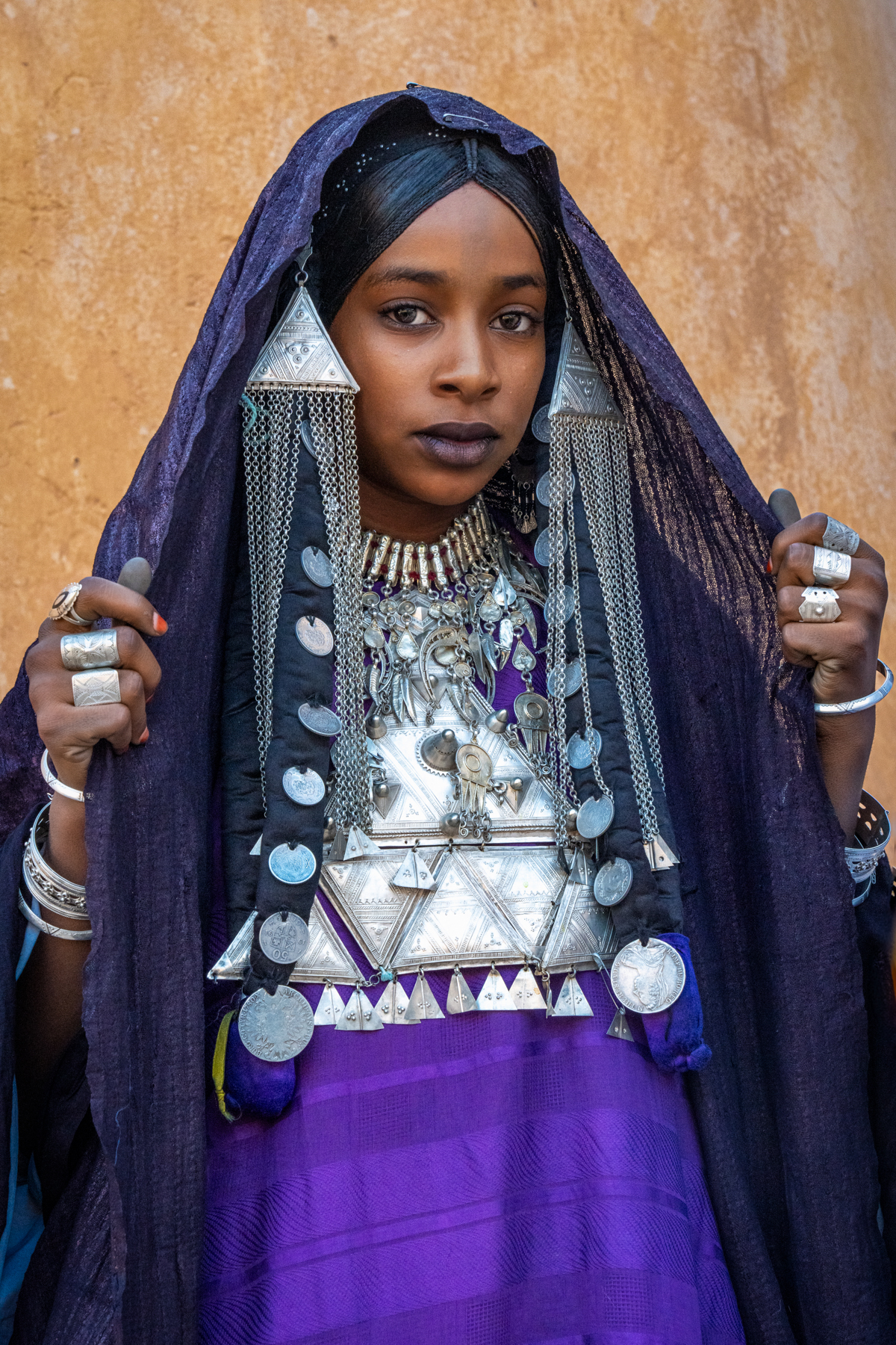 Beautiful Tuareg girl showing her incredible silver jewellery inside the Ksour of Taghorfit, near Djanet (image by Inger Vandyke)