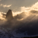 Low cloud at sunset swirls around the darkening Torres del Paine mountains in Patagonia, Chile (image by Virginia Wilde)