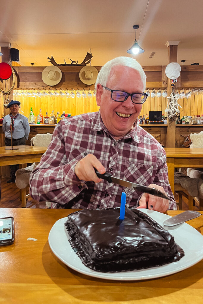 Martin celebrates his 70th birthday on tour, with a large chocolate cake (image by Virginia Wilde)