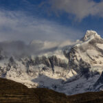 Low cloud swirls around the mountains of the Paine Massif in Patagonia (image by Virginia Wilde)