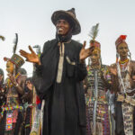 A Wodaabe elder claps to guide the young men performing at the Gerewol (image by Inger Vandyke)