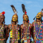 Young Wodaabe men singing at the Gerewol Festival. The only way to describe them is beautiful (image by Inger Vandyke)