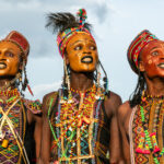 A trio of young Wodaabe men performing at the Gerewol (image by Inger Vandyke)