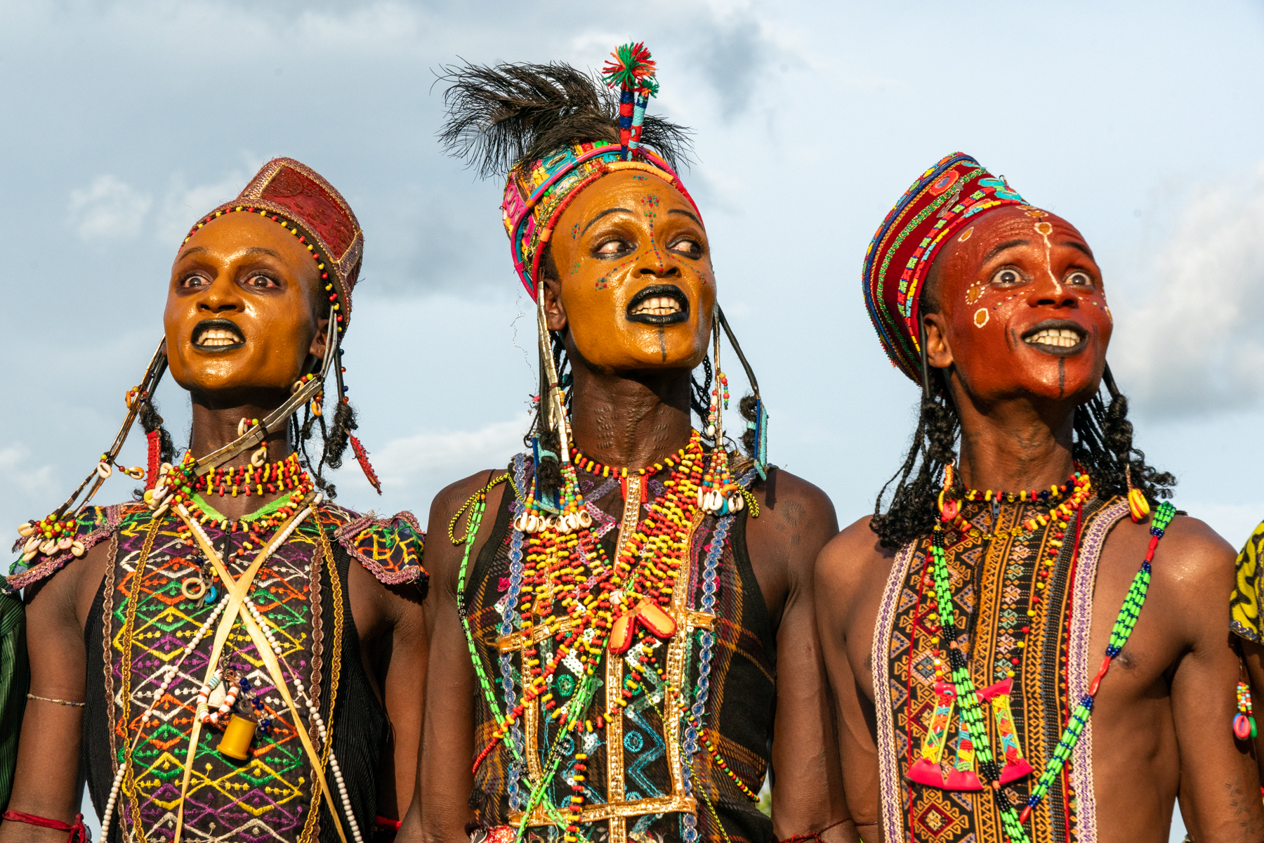 A trio of young Wodaabe men performing at the Gerewol (image by Inger Vandyke)