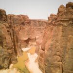 Our guests walk into the base of the Guelta D'Archei oasis in the Ennedi (image by Inger Vandyke)