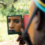 A mirror view of a young Wodaabe man (image by Inger Vandyke)