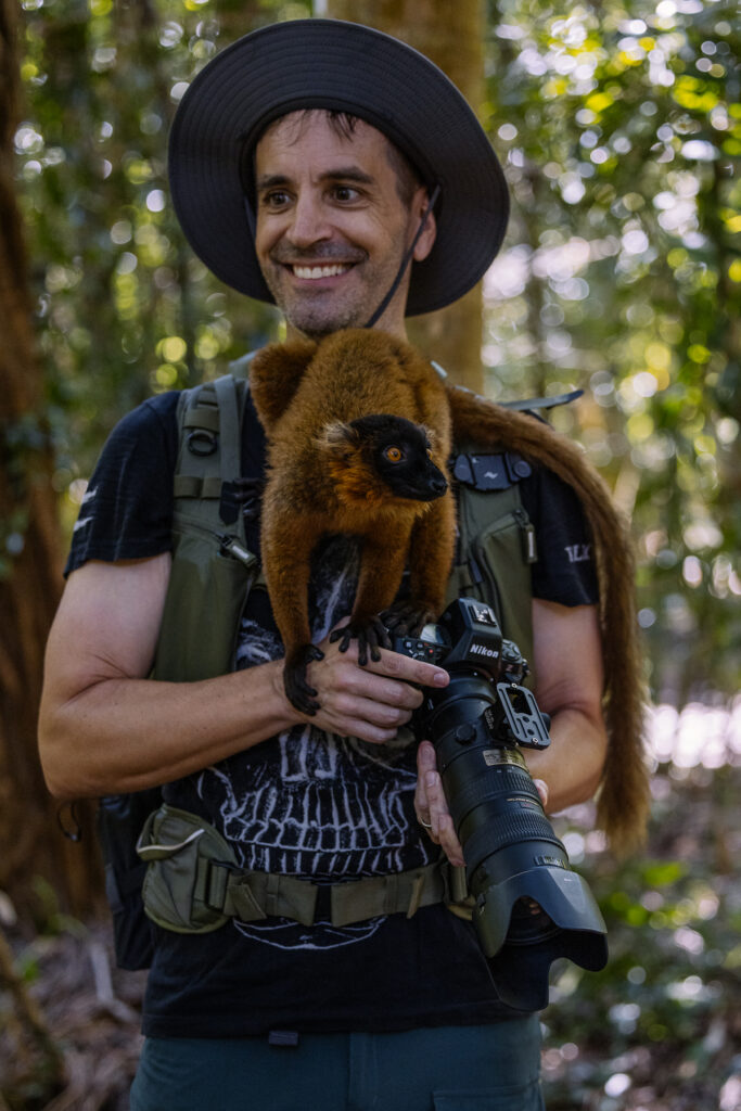 Torsten gives up trying to take pictures as a wild lemur sits on him (image by Virginia Wilde)