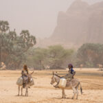 Toubou girls fetch water from Bachekele Oasis during an Araï, or dust storm (image by Inger Vandyke)