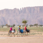 Toubou girls riding their donkeys through the Ennedi (image by Inger Vandyke)