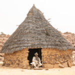 A Toubou elder in the doorway of a traditional Toubou home in the Ennedi (image by Inger Vandyke)