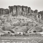 A beautiful Toubou homestead nestled at the base of a stunning Ennedi massif (image by Inger Vandyke)