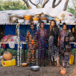Young Wodaabe girls outside their Wuro (family home) in remote southern Chad (image by Inger Vandyke)