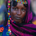 At dusk a beautiful Wodaabe girl joins the throngs of young women there to assess the attractiveness of young Wodaabe men (image by Inger Vandyke)