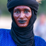 The Gerewol Festival attracts Wodaabe men from Chad and Nigeria in southern Chad. Portrait of a Nigerian Wodaabe who came to watch the dancing with us (image by Inger Vandyke)