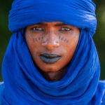 A stunning Wodaabe young man in blue (image by Inger Vandyke)