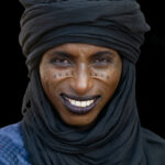 The smiling face of a Wodaabe gent attending the Gerewol festival (image by Inger Vandyke)