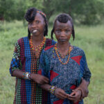 Young Wodaabe girls also get into the spirit of the Gerewol and pull faces (image by Inger Vandyke)