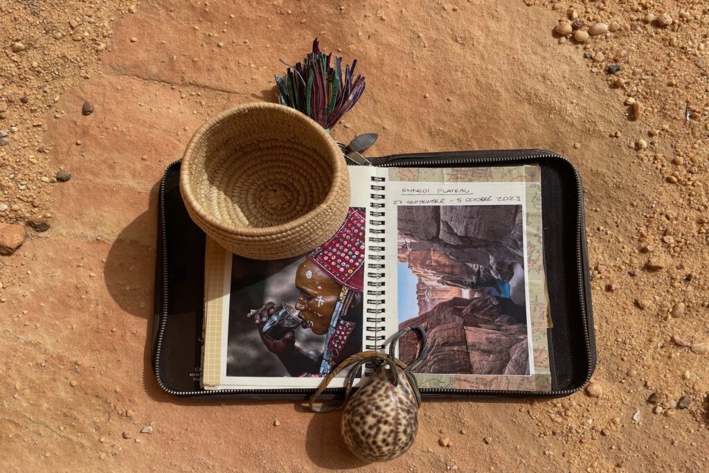 Notes from the field alongside a handmade Toubou basket and a shell for good luck (image by Inger Vandyke)