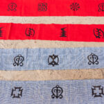 Our Wild Images group got to create their own Adinkra cloth during our 2024 tour. Here their creations lay drying in the sun (image by Inger Vandyke)