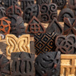 Wooden stamps used in the creation of Adinkra. Each one has a special meaning (image by Inger Vandyke)