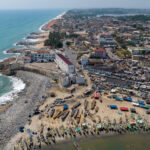 Aerial view of Cape Coast Castle, its fishing pirogues and fortified beach (image by Inger Vandyke)