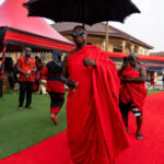 An Ashanti Chief arrives at a funeral under the shade of a customary umbrella (image by Inger Vandyke)
