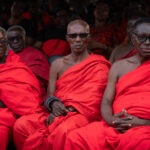 A line of elders watch the proceedings at an Ashanti funeral in Kumasi, Ghana (image by Inger Vandyke)