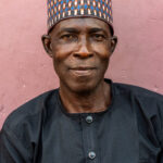 Portrait of an Ashanti man attending a funeral in Kumasi, Ghana (image by Inger Vandyke)