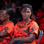 Ashanti women dressed in red and black to attend the Saturday ceremony of an Ashanti Funeral (image by Inger Vandyke)