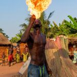 Breathing fire at a Zangbeto ceremony (image by Inger Vandyke)