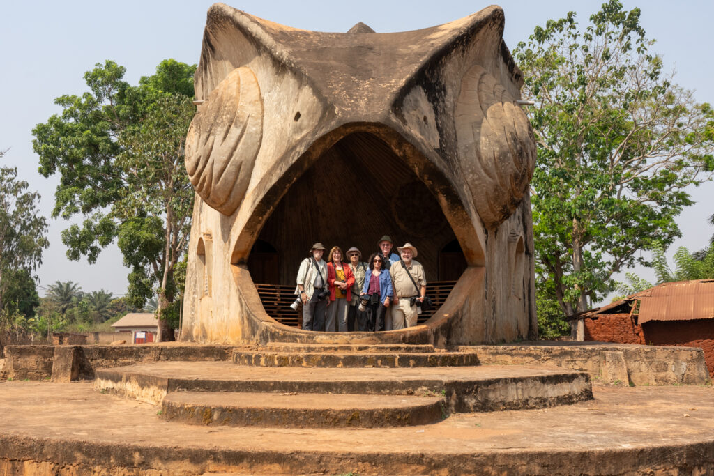 Our 2024 Wild Images group inside the gigantic mouth of the Chameleon at the Chameleon Temple in Abomey (image by Inger Vandyke)
