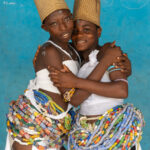 Older Dipo initiates hugging each other in the palace of King Suorwu of Somanya, Ghana (image by Inger Vandyke)