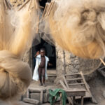 An excited little girl comes out to greet us as we wandered around her village in Benin (image by Inger Vandyke)