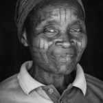 The amazing facial scarification of an elderly Holi lady in remote Benin (image by Inger Vandyke)