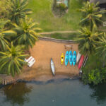 Kayaks waiting for action on a beach at the side of the Volta River in Ghana (image by Inger Vandyke)