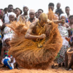 An airborn Koku dancer at the annual Voodoo Festival of Benin (image by Inger Vandyke)