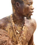 Portrait of a Koku dancer covered in Kaolin powder and yellow palm oil - the symbols of the Koku divinity (image by Inger Vandyke)