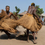 Athletic Koku dancers twirl with their amazing grass skirts (image by Inger Vandyke)