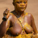 A Koku devotee covered in Kaolin and yellow palm oil, the symbols of the Voodoo divinity of strength and power (image by Inger Vandyke)