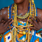 The golden beads of an older Dipo initiate in the Krobo culture of Benin (image by Inger Vandyke)